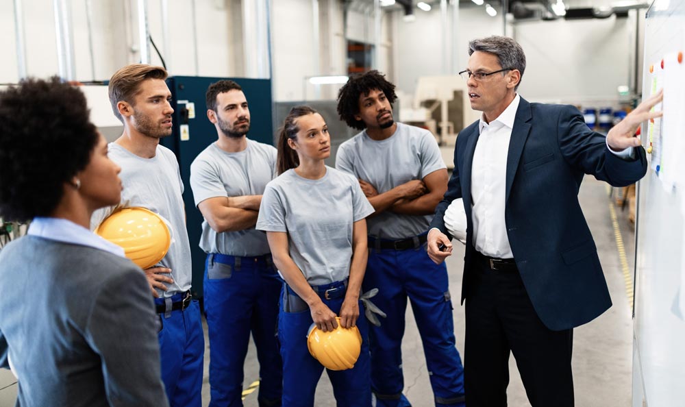 IT manager talking with workers